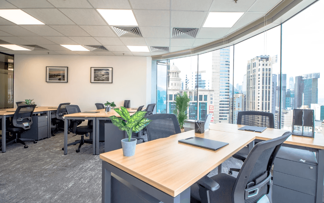 Bright office with a panoramic city view and modern furniture.